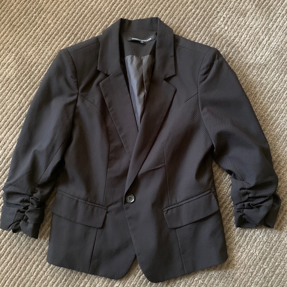 light blazer with ruffled, cuffed sleeves